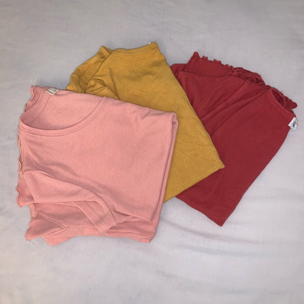 3 t shirts with ruffles on the end